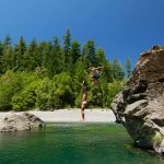 people jumping into Chetco River