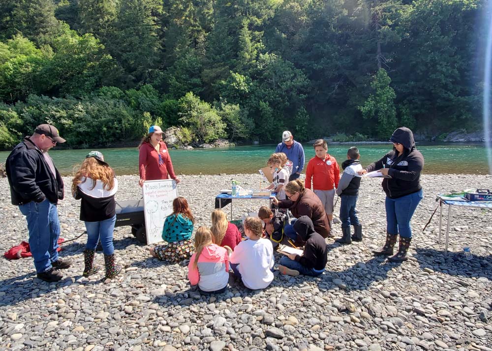 teaching children on river bank